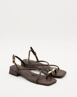 Sandals with cross-over straps and metal ring